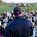 Saline head coach Brian Boze talks to the team with a purple ribbon tied to his hat on Tuesday, April 30. Daniel Brenner I AnnArbor.com